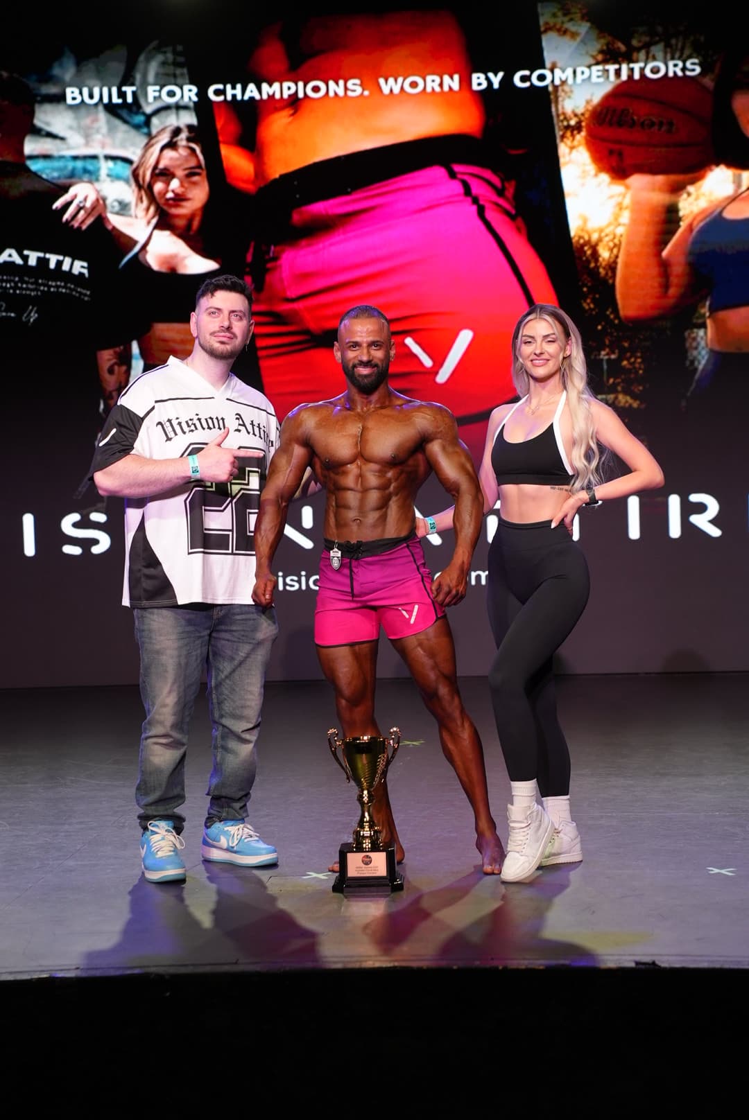 Puneet receiving award on stage at bodybuilding competition